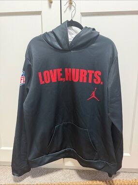 Eagles Black Hoodie with Red "LOVE, HURTS." Script